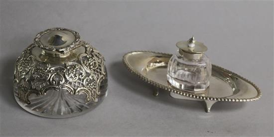 An Edwardian silver mounted domed top glass inkwell, William Comyns, London, 1905 and one other inkwell, Birmingham, 1901.